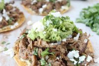 Crispy and Tender Slow Cooker Carnitas Tostadas