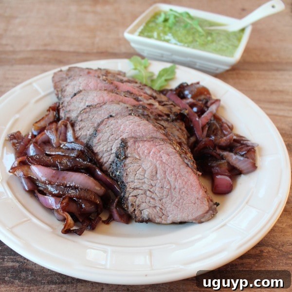 Garlic Walnut Crusted Tri Tip - Sliced grilled tri-tip steak, showing the beautiful crust and juicy interior.