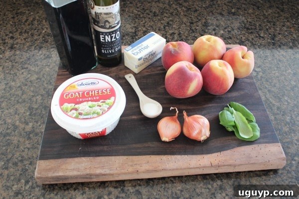 Ingredients for Grilled Peach Flatbread laid out including peaches, goat cheese, basil, and balsamic