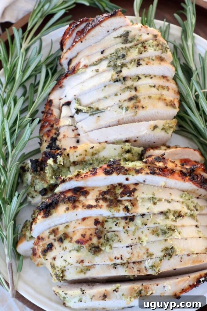 slices of turkey breast on plate with fresh herbs
