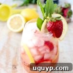 Fresh lemons and strawberries are mixed with bubbly prosecco for a refreshing prosecco sangria recipe that is perfect for spring and summer!
