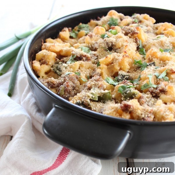 A delicious close-up of Spicy Sausage Macaroni and Cheese, highlighting the texture and gooey cheese, ready to be enjoyed.