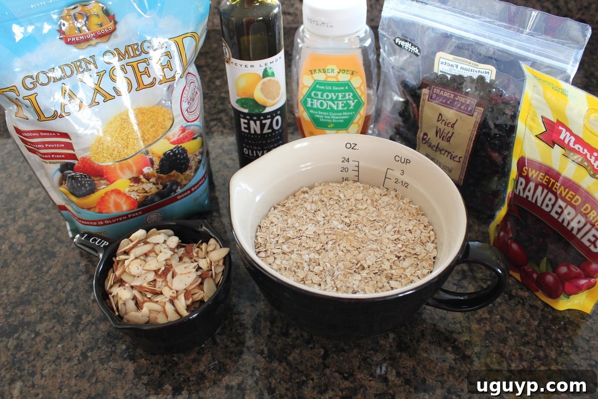 Fresh ingredients for homemade heart healthy granola bars, including oats, almonds, flaxseed, and mixed berries.