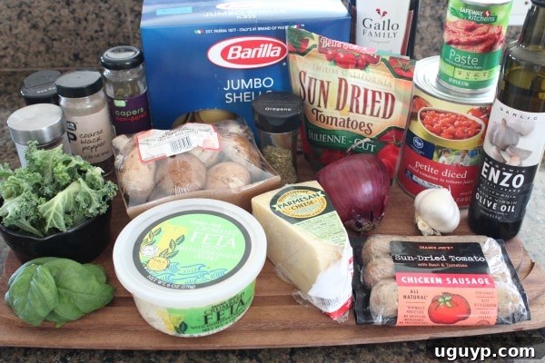 A vibrant display of Mediterranean Stuffed Shells Ingredients laid out on a wooden surface.