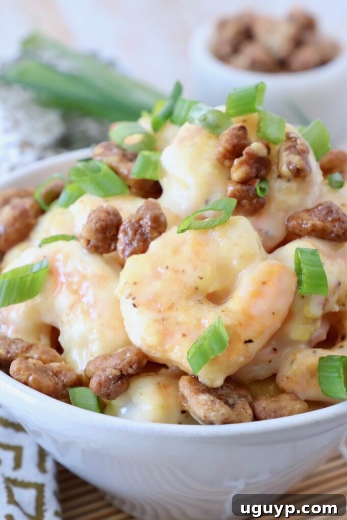 A close-up view of Honey Walnut Shrimp in a bowl, showcasing its delicious texture.