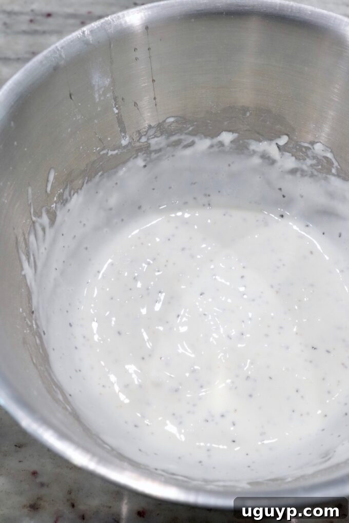 A bowl of freshly prepared shrimp batter, ready for coating.