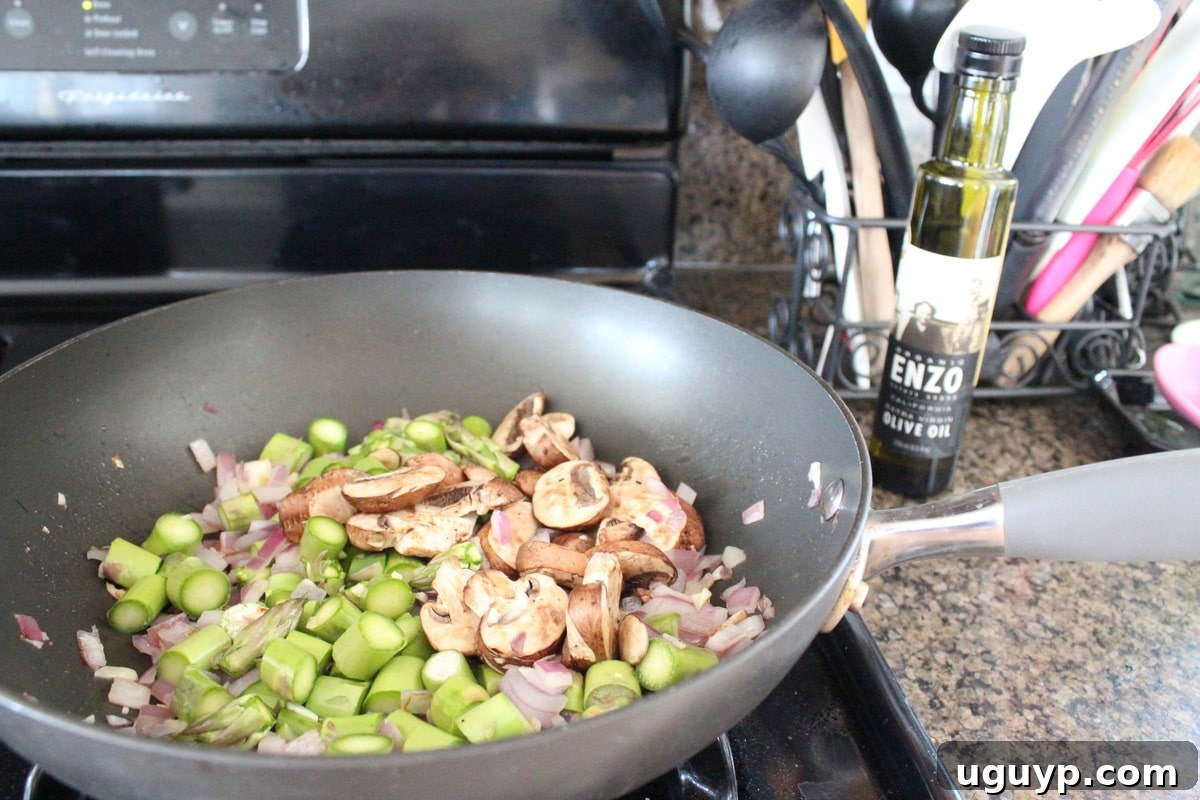 Sautéed onions and garlic in a skillet, the first step for the vegetable stuffing recipe