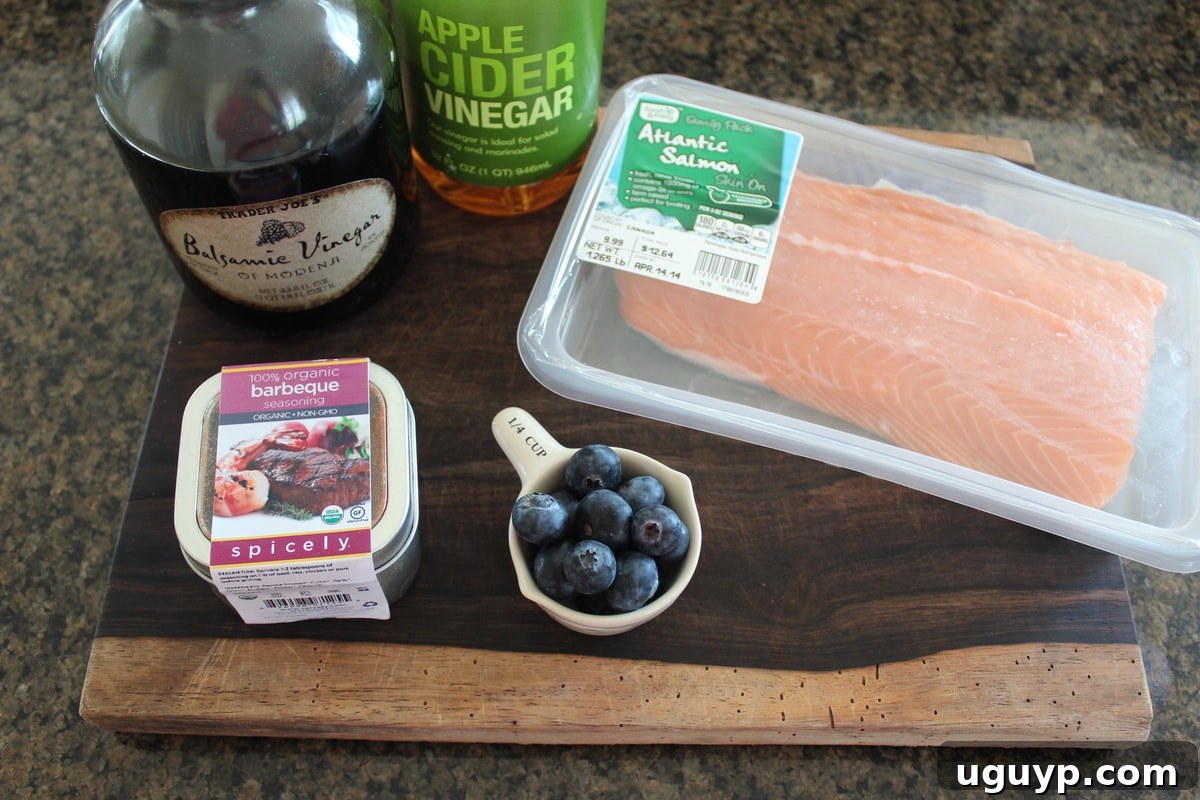Key ingredients for Homemade Blueberry BBQ Sauce and Grilled Salmon laid out.