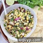 corn salsa in bowl with spoon