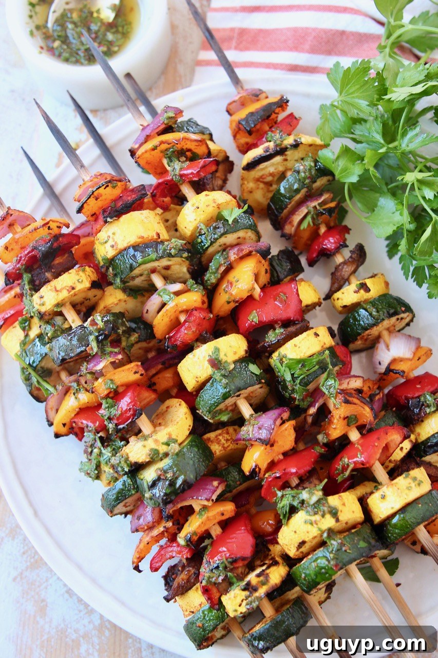 grilled vegetables on skewers on white plate