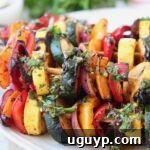 grilled vegetables on skewers on plate