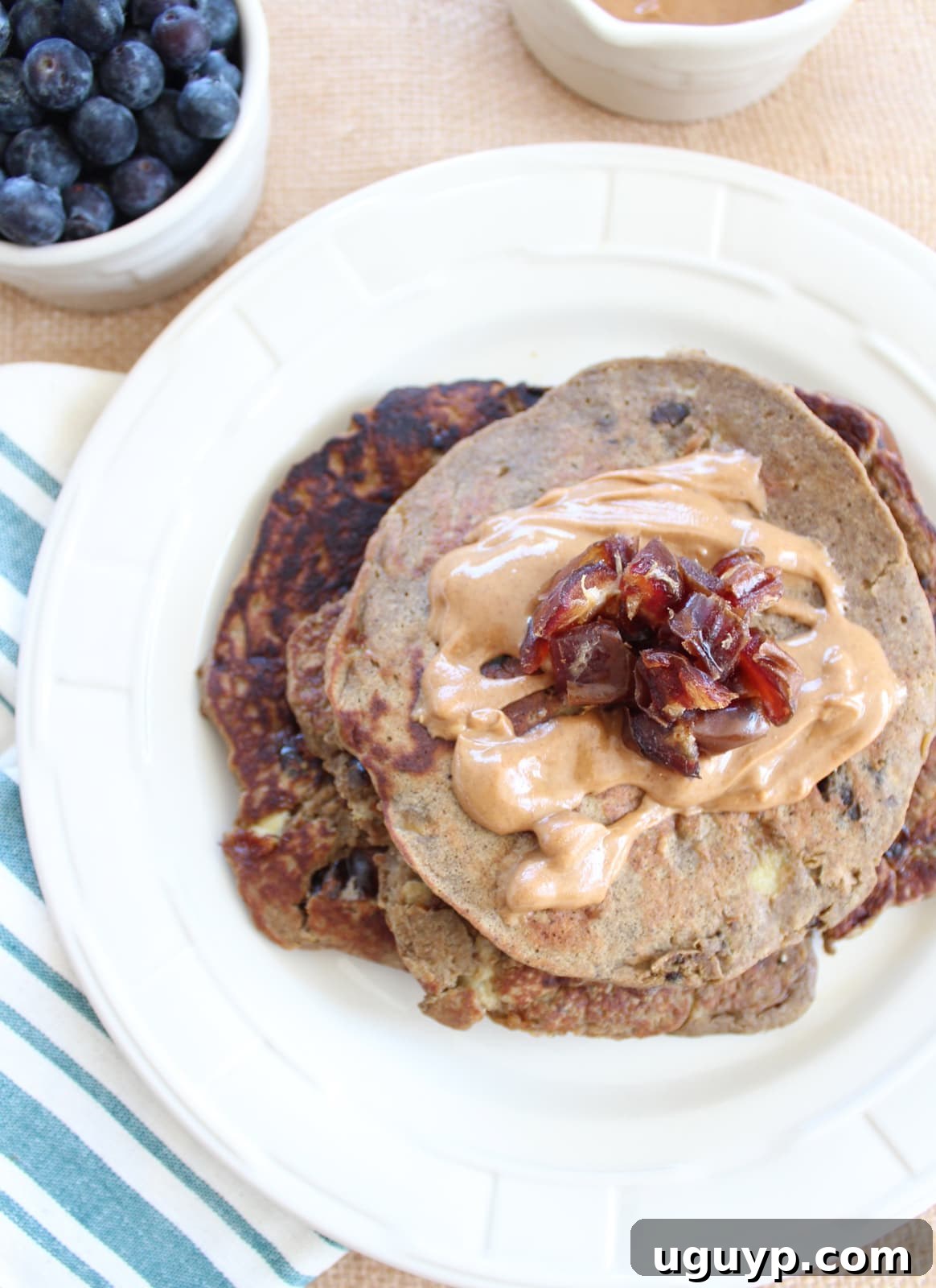Delicious Banana Date Protein Pancakes stack ready to be served