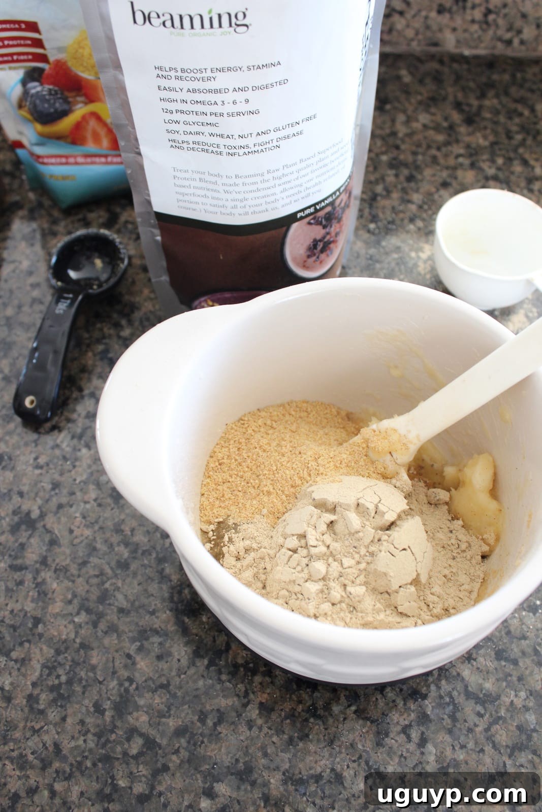 Mixing banana, egg, protein powder, and flax seeds for pancake batter