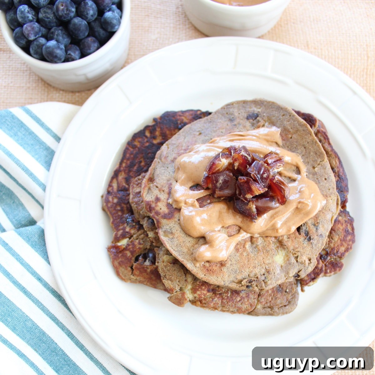 Stack of protein pancakes with peanut butter syrup
