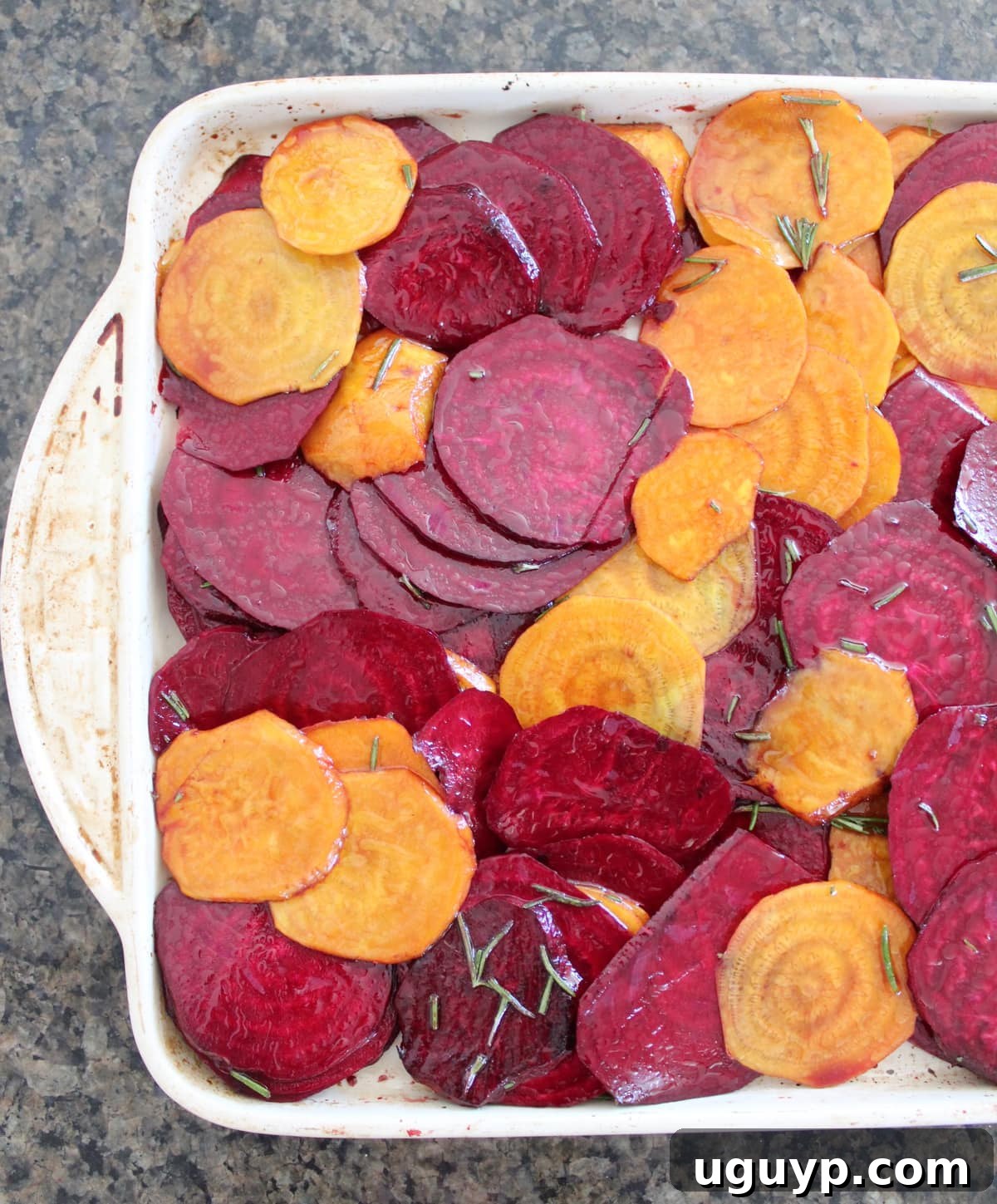 Beets spread on a baking sheet for roasting