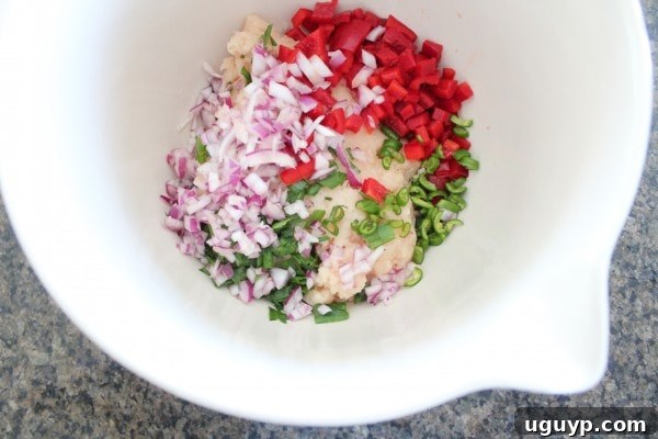 Mixing Asian Chicken Slider ingredients