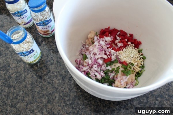 Adding Litehouse herbs to chicken mixture