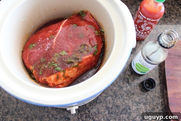 Pouring Sauce Over Crock Pot Thai Beef