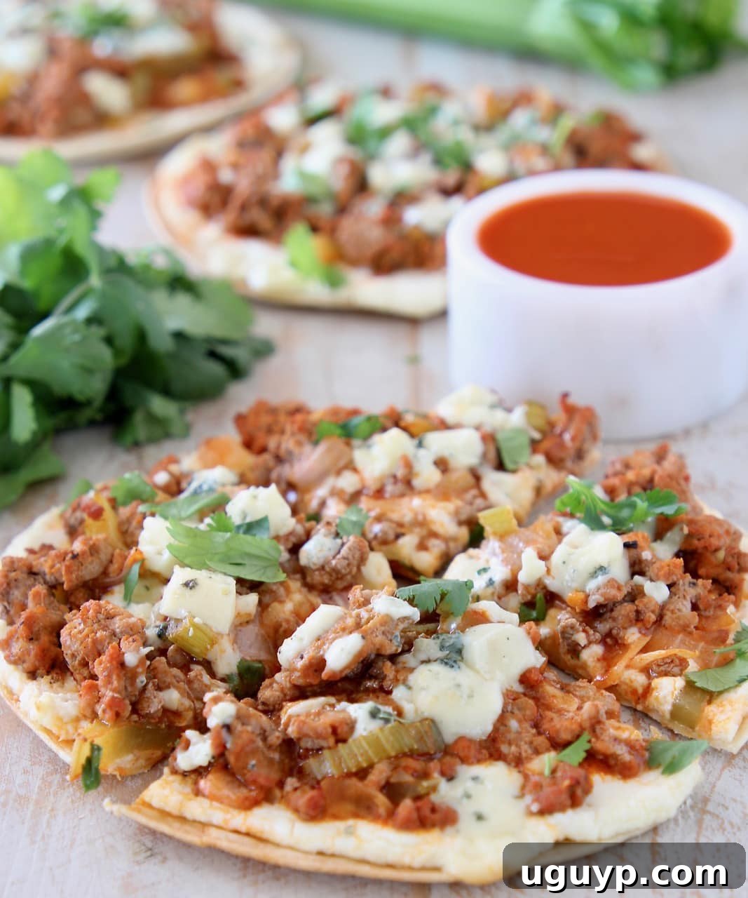 Buffalo ground turkey on flatbread topped with blue cheese crumbles