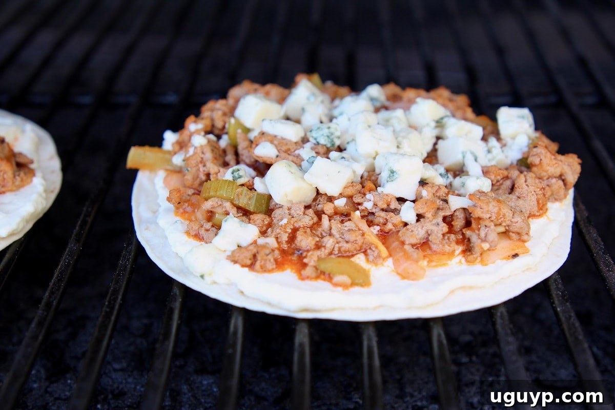 Buffalo turkey flatbread on a grill