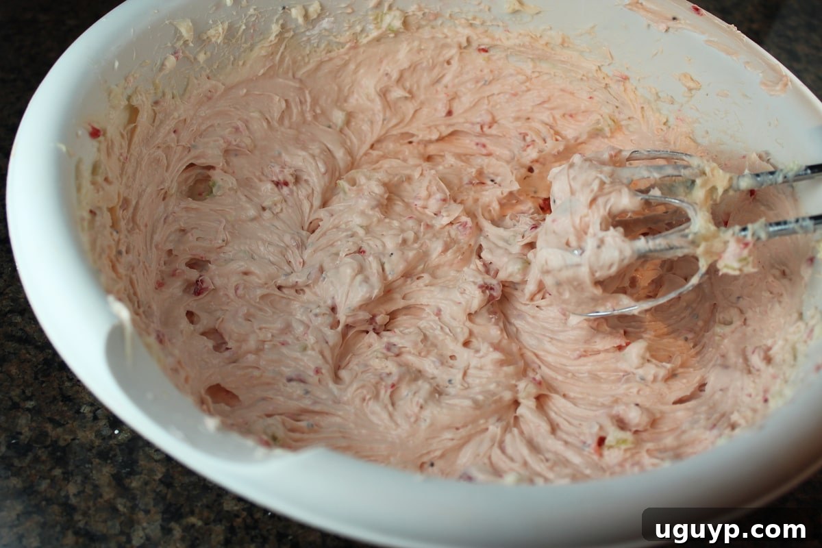 Smooth and creamy Strawberry Kiwi Cream Cheese Frosting