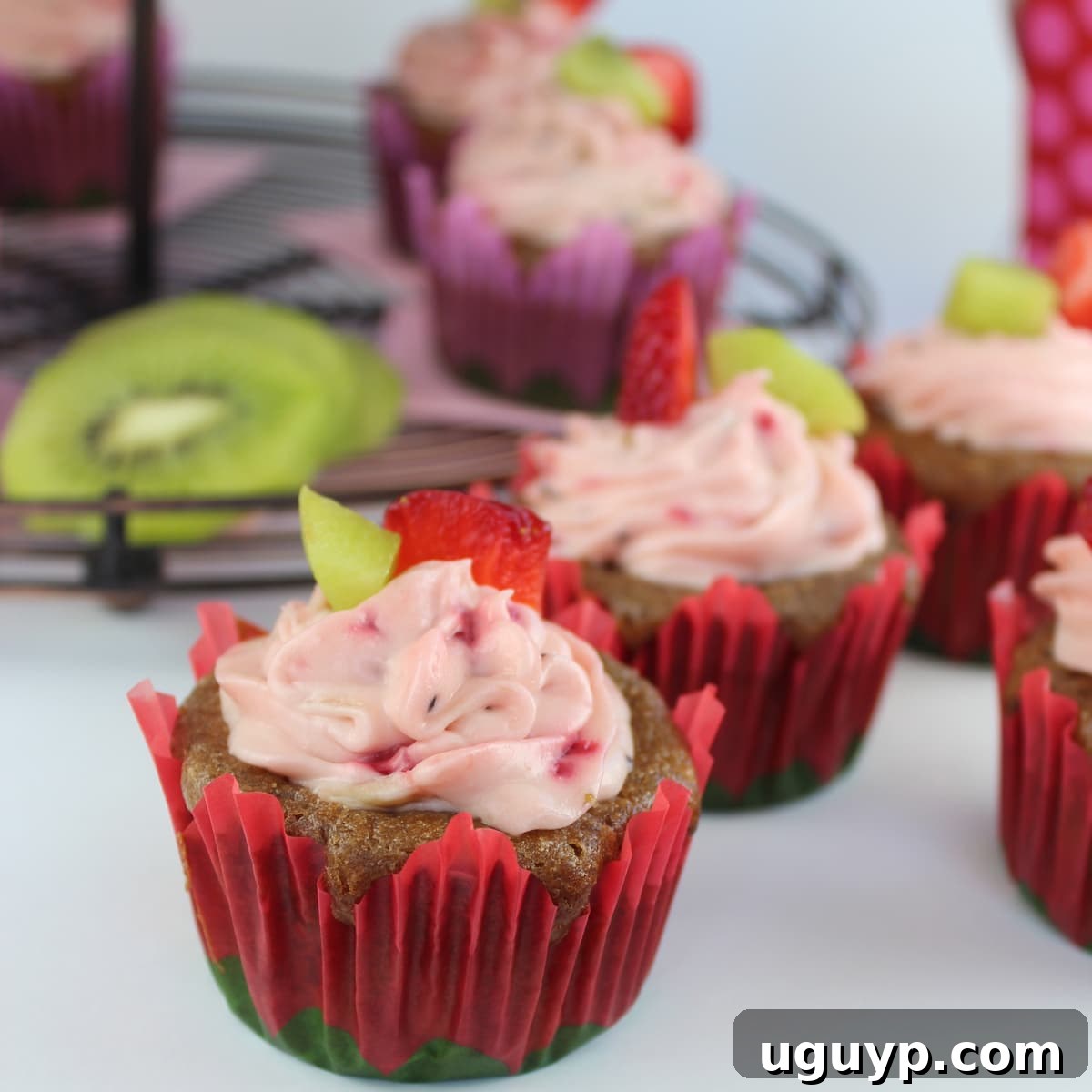 Beautifully frosted Fresh Strawberry Kiwi Cupcakes, ready to serve