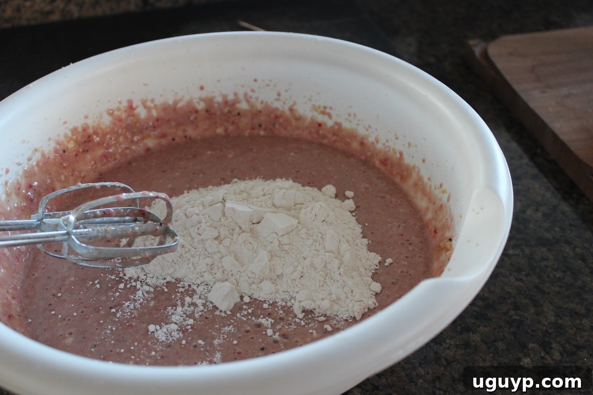 Mixing the cupcake batter for strawberry kiwi cupcakes
