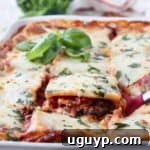 slice of vegetable lasagna being lifted out of casserole dish