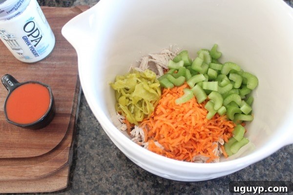 Mixing Buffalo Chicken Salad Ingredients