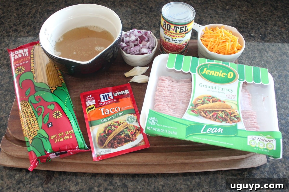Sautéed red onion, minced garlic, and ground turkey cooking in a large pot, filling the kitchen with inviting aromas.