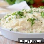 Roasted spaghetti squash tossed in a cheese sauce in a white baking dish