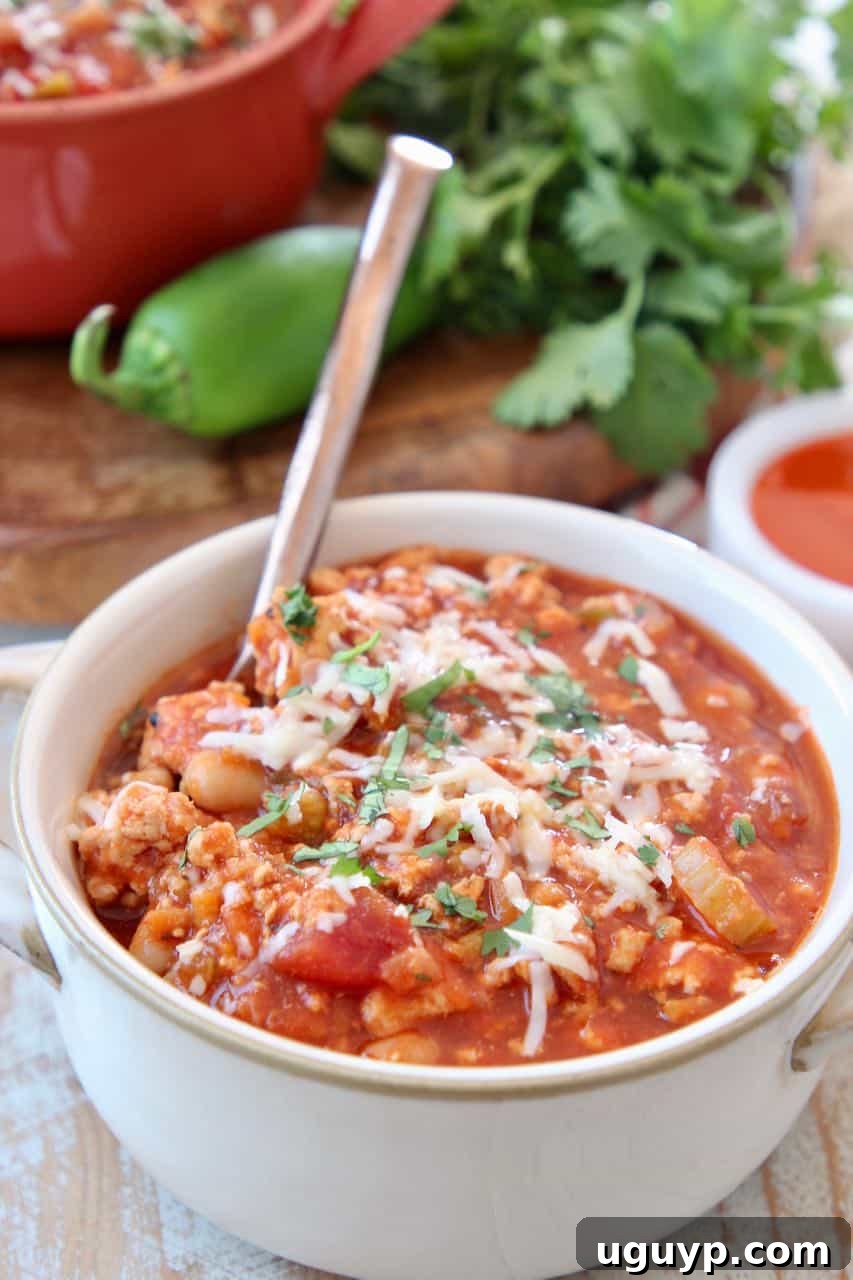 Chili in white bowl with spoon