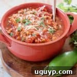 Chili in orange bowl with spoon