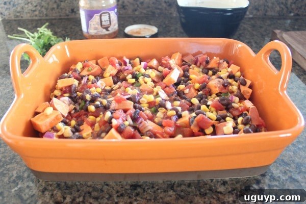 Mexican Chipotle Sweet Potato Casserole Recipe being prepared in a baking dish.