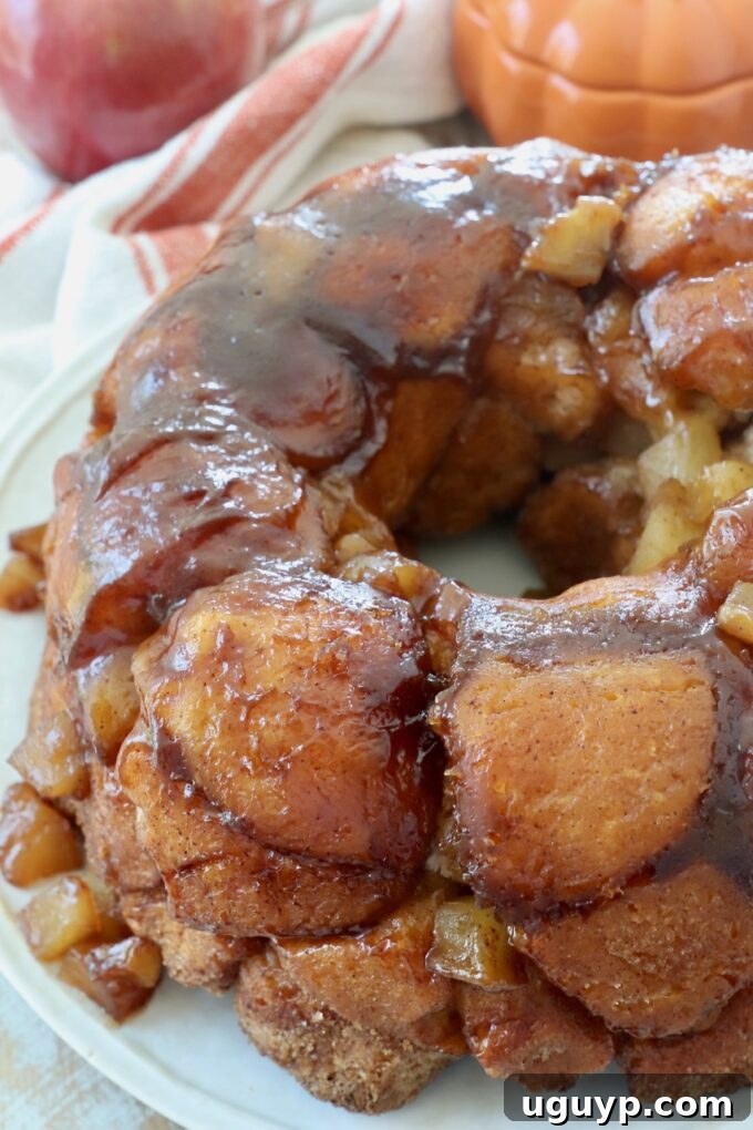 The finished Pumpkin Apple Monkey Bread beautifully inverted onto a serving plate, ready to be pulled apart.