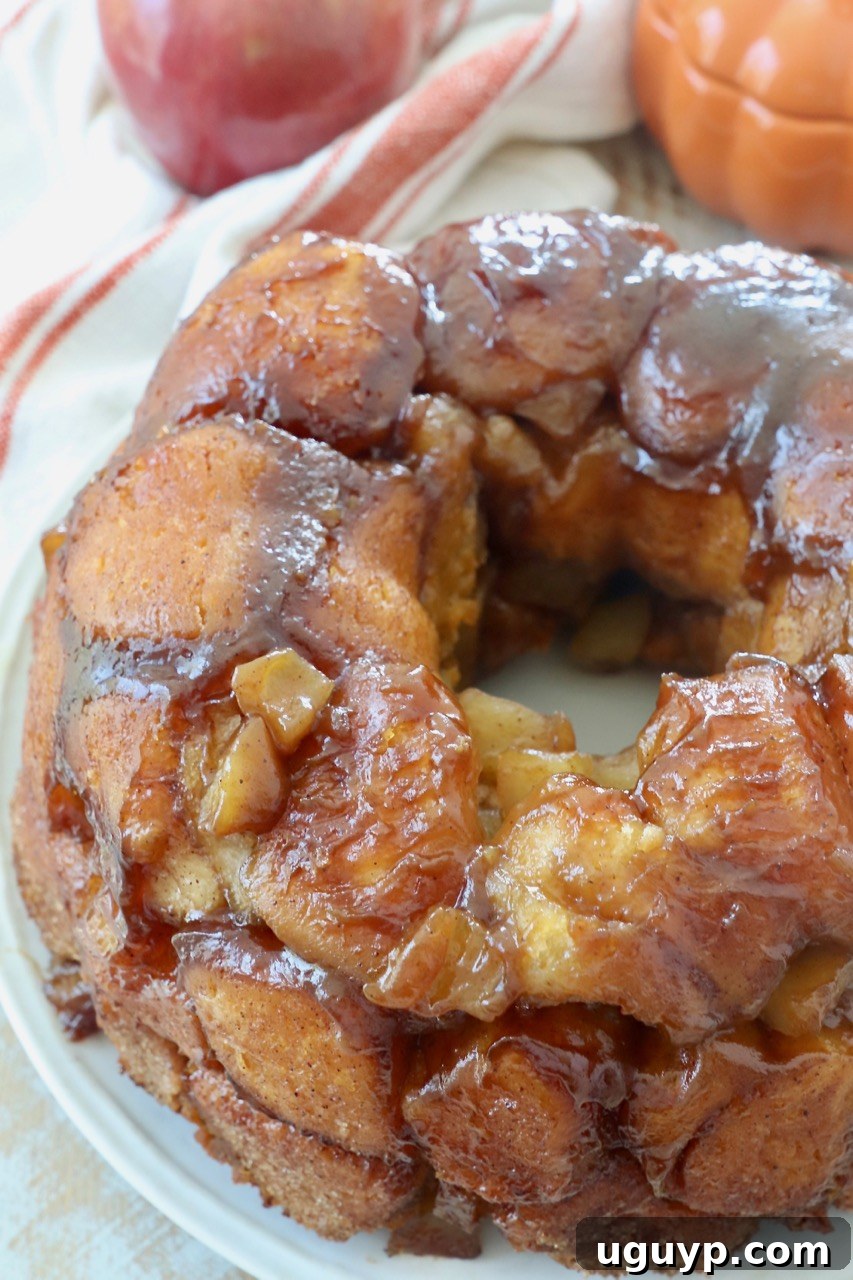 A whole Pumpkin Apple Monkey Bread on a serving plate, inviting everyone to pull a piece.