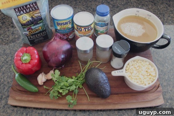 Ingredients for One Pot Vegan Mexican Freekeh laid out, including freekeh, vegetables, and spices.