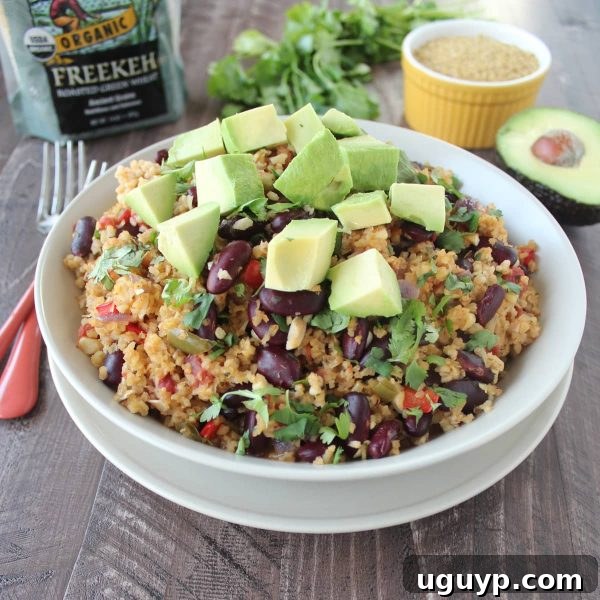 A beautifully plated bowl of One Pot Vegan Mexican Freekeh, ready to be enjoyed.
