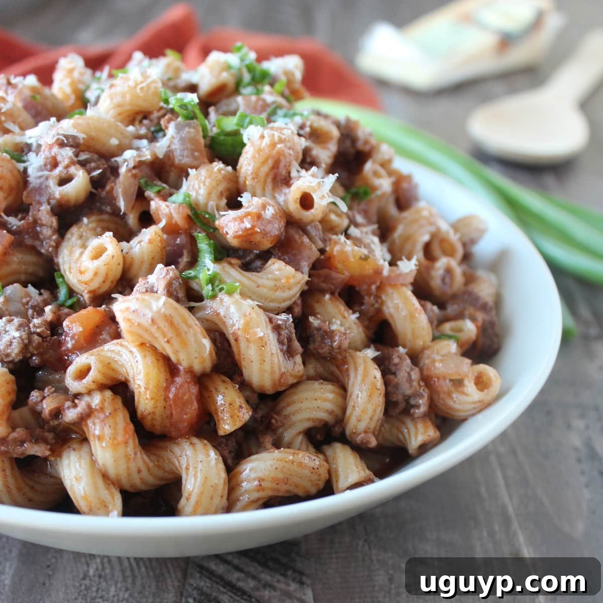 A generous serving of the finished one-pot ground beef and macaroni dish in a bowl, showcasing its rich color and inviting texture.