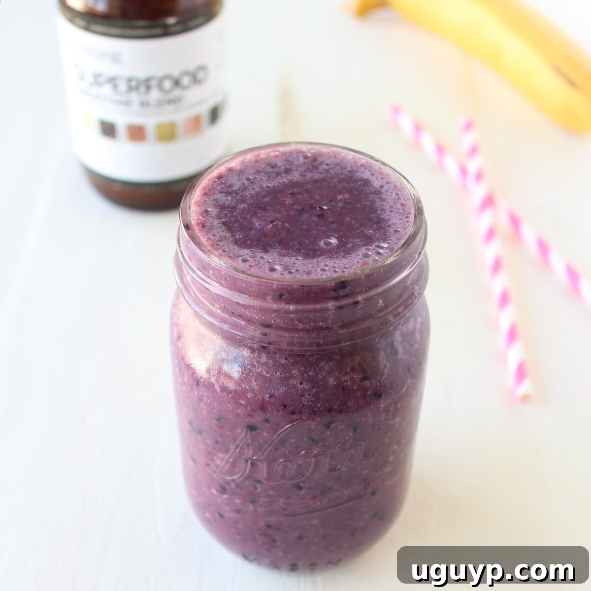 Close-up of Immunity Boosting Orange Berry Smoothie with fresh berries