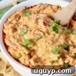 cheeseburger dip in bowl with spoon