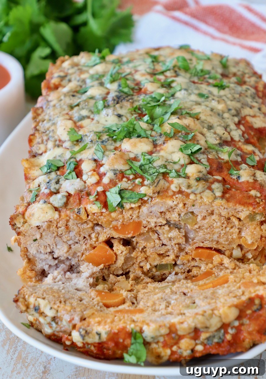 buffalo chicken meatloaf sliced on plate