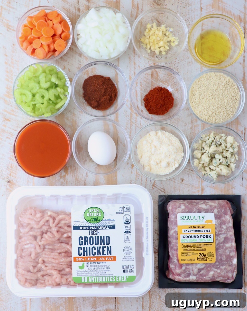 ingredients for buffalo chicken meatloaf on white wood board