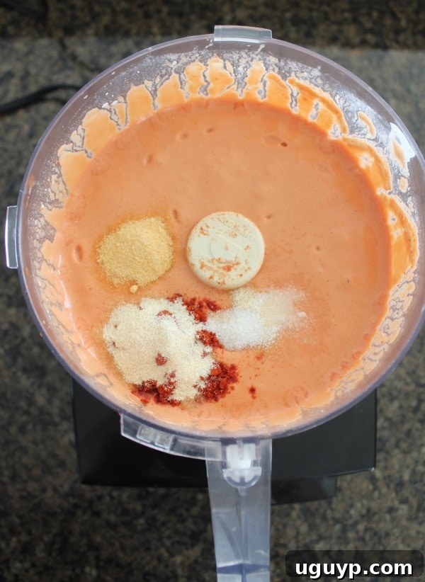 creamy sauce with spices in a food processor