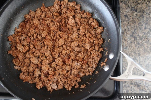 cooked ground beef in a skillet