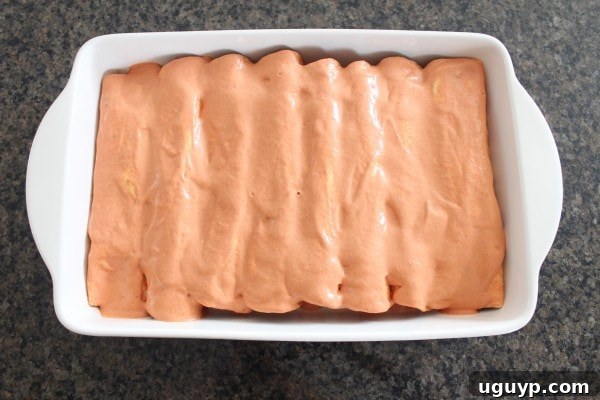 enchiladas in a creamy sriracha sauce in a baking dish