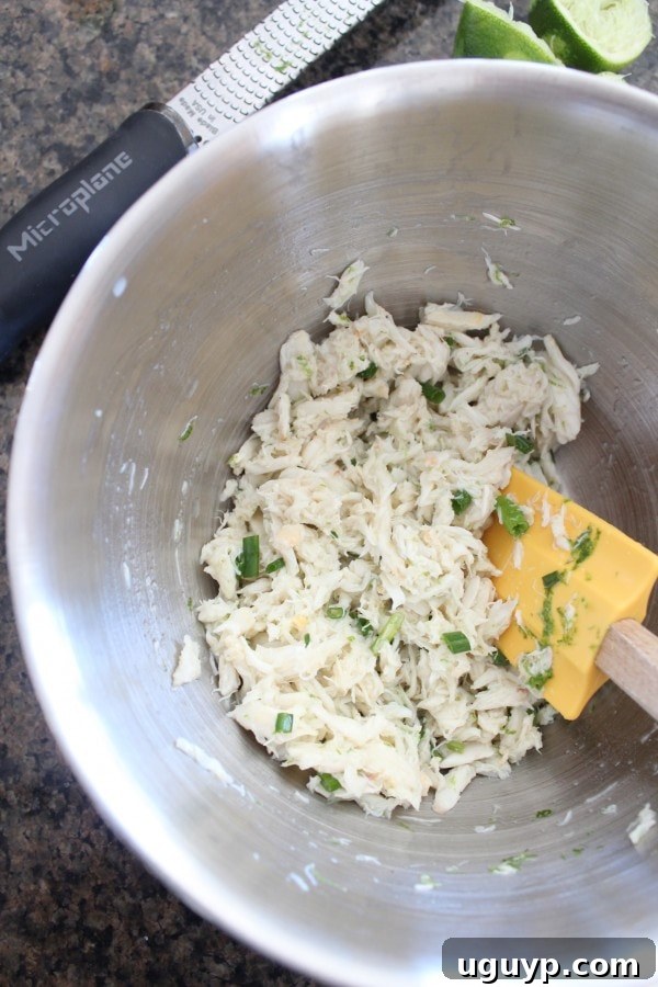 Preparing the crab mixture with chives, lime juice, and lime zest for healthy tacos