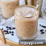 Long Island drink with coffee in glasses with gold and white striped straws