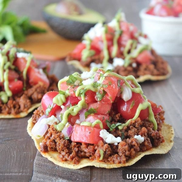 Close-up of a Chorizo Tostada featuring the vibrant watermelon salsa.