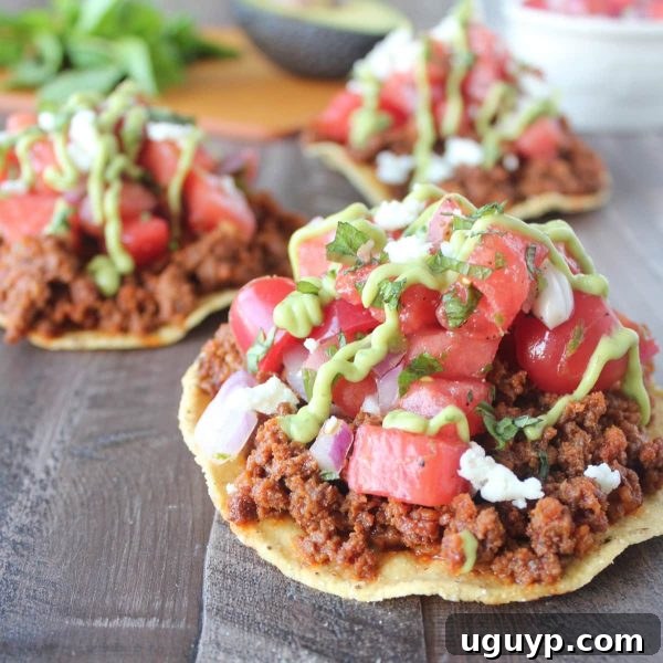 Close-up of a Chorizo Tostada with Watermelon Salsa, showcasing its fresh ingredients.